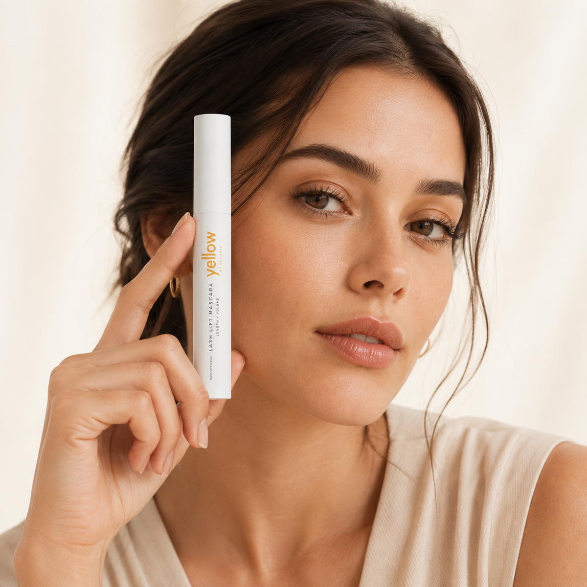 Woman holding Yellow Lash Lift Mascara